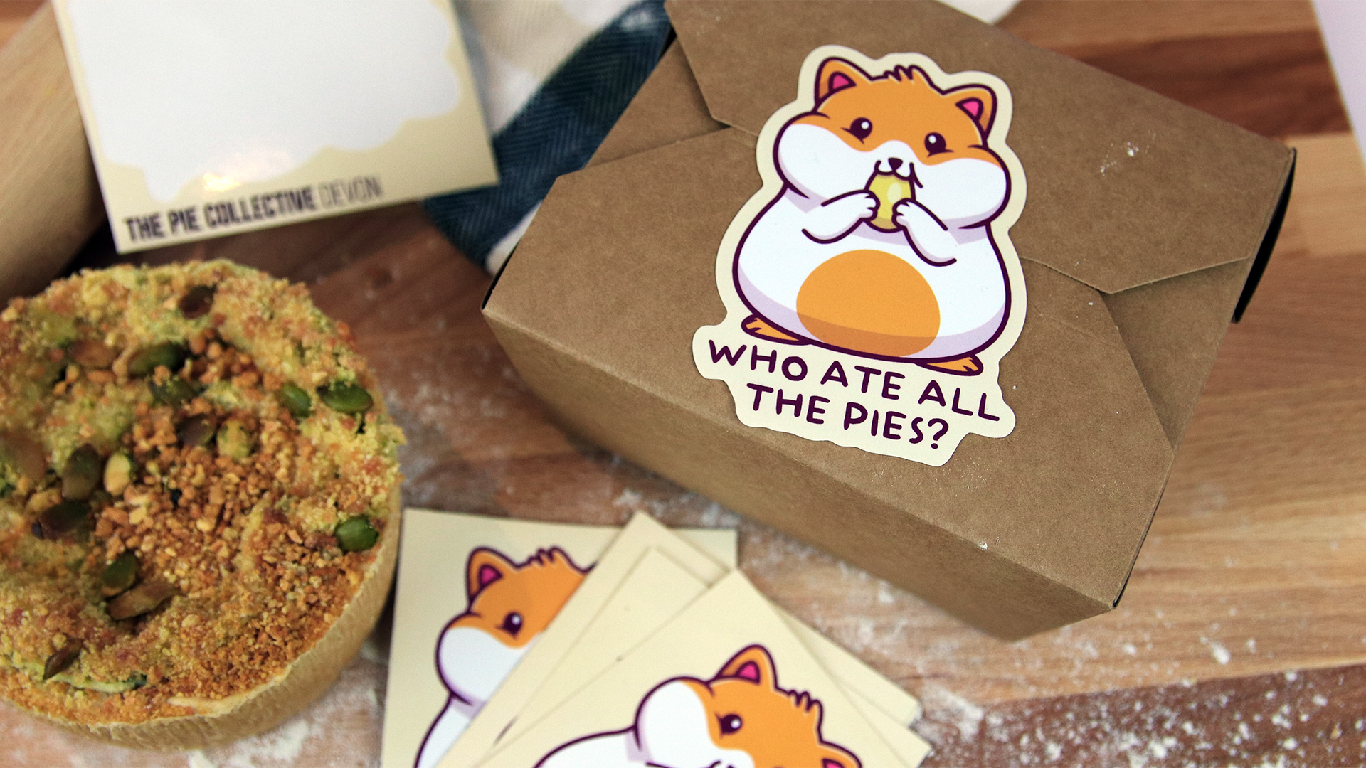 white-vinyl-kiss-cut-sticker-with-hamster-design-applied-to-a-cardboard-food-box.jpg
